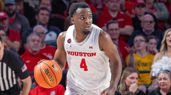 Houston guard L.J. Cryer dribbles against West Virginia